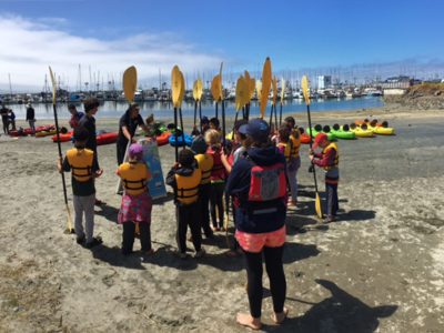 Campers getting ready to kayak