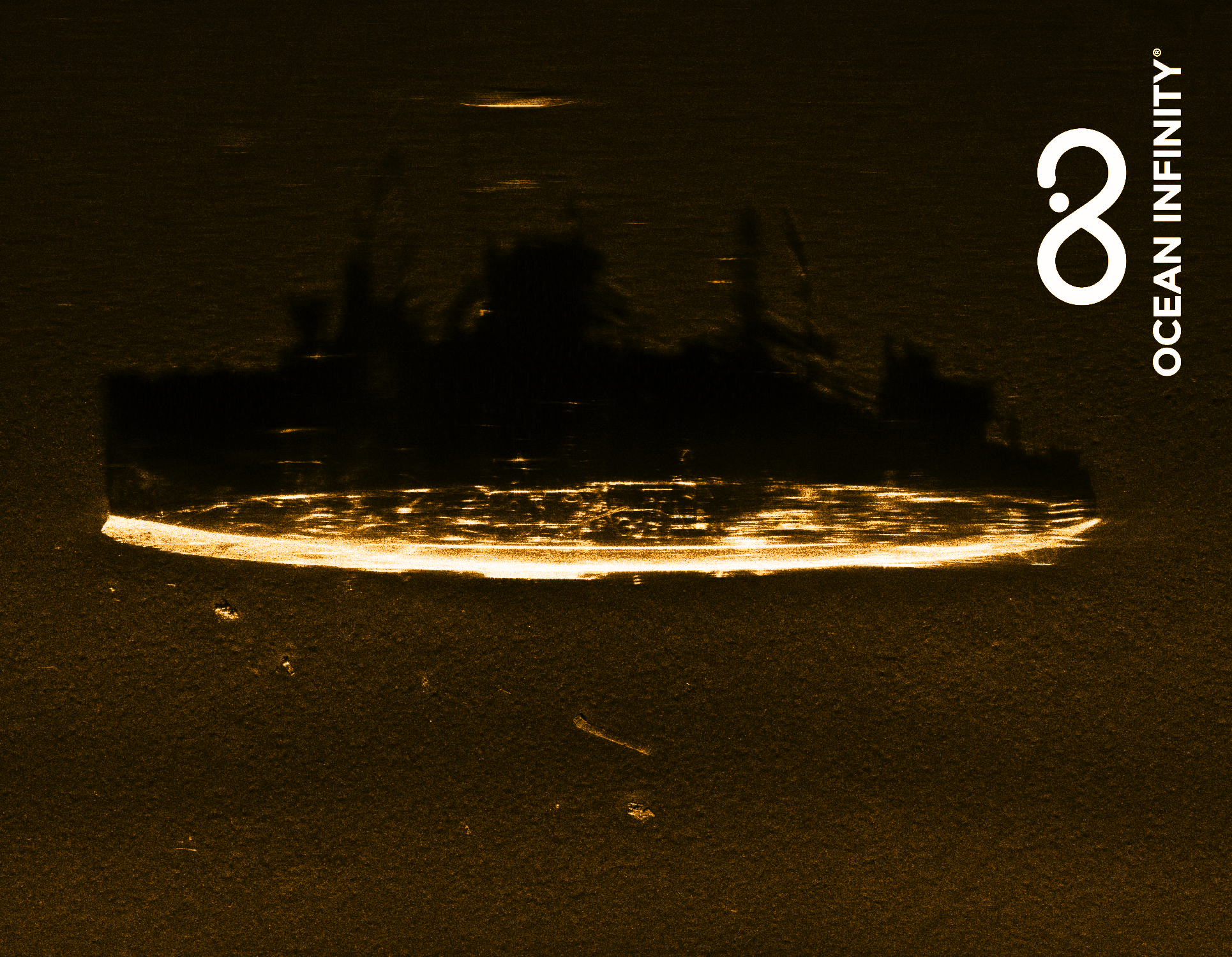 USS Stewart seen from above with shadow casted on seabed